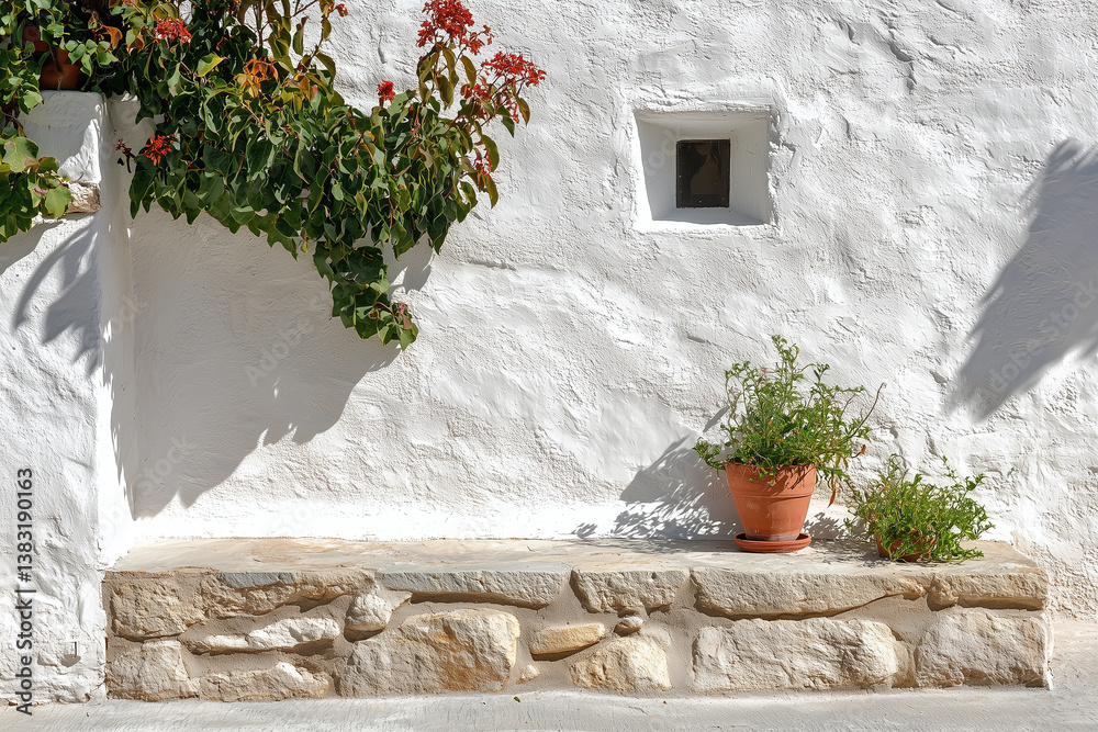 serene white plaster wall adorned with vibrant flowers and potted plant, creating peaceful outdoor space. natural textures and colors evoke sense of tranquility and simplicity