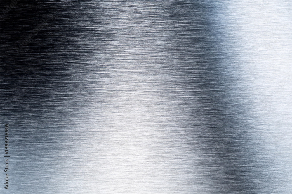 Metallic surface with a brushed finish reflecting light and textures under natural illumination in a spacious setting Metallic surface with a brushed finish reflecting light and textures under natural illumination in a spacious setting