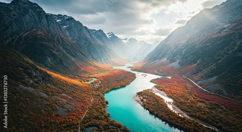 Fototapeta Naklejka Na Ścianę i Meble -  A mystical mountain landscape covered in fog, with a river flowing through the valley