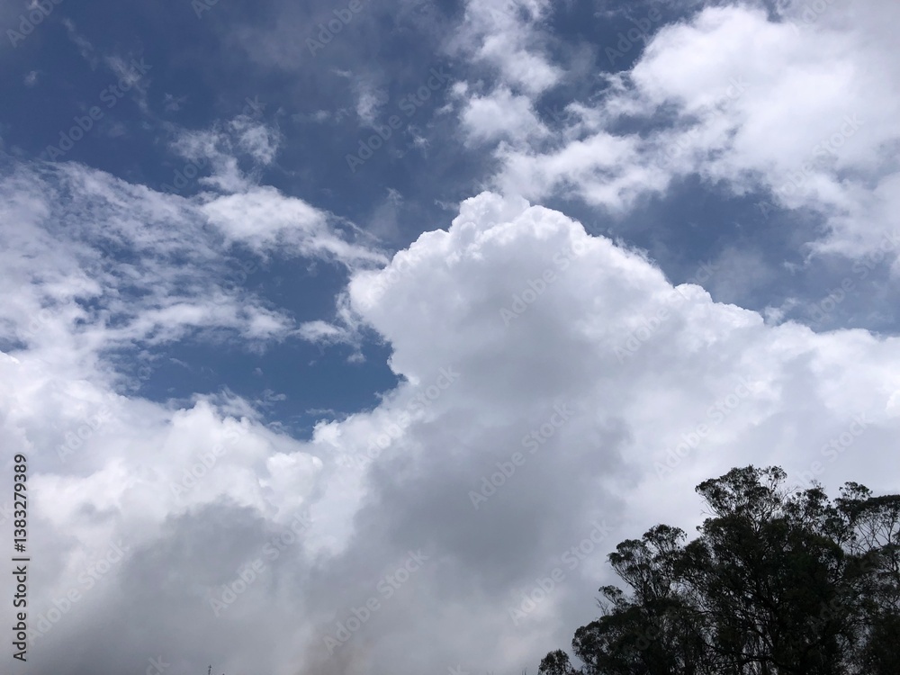 a beautiful view of the sky, showcasing a mix of white and gray clouds with a deep blue sky visible in between a beautiful view of the sky, showcasing a mix of white and gray clouds with a deep blue sky visible in between