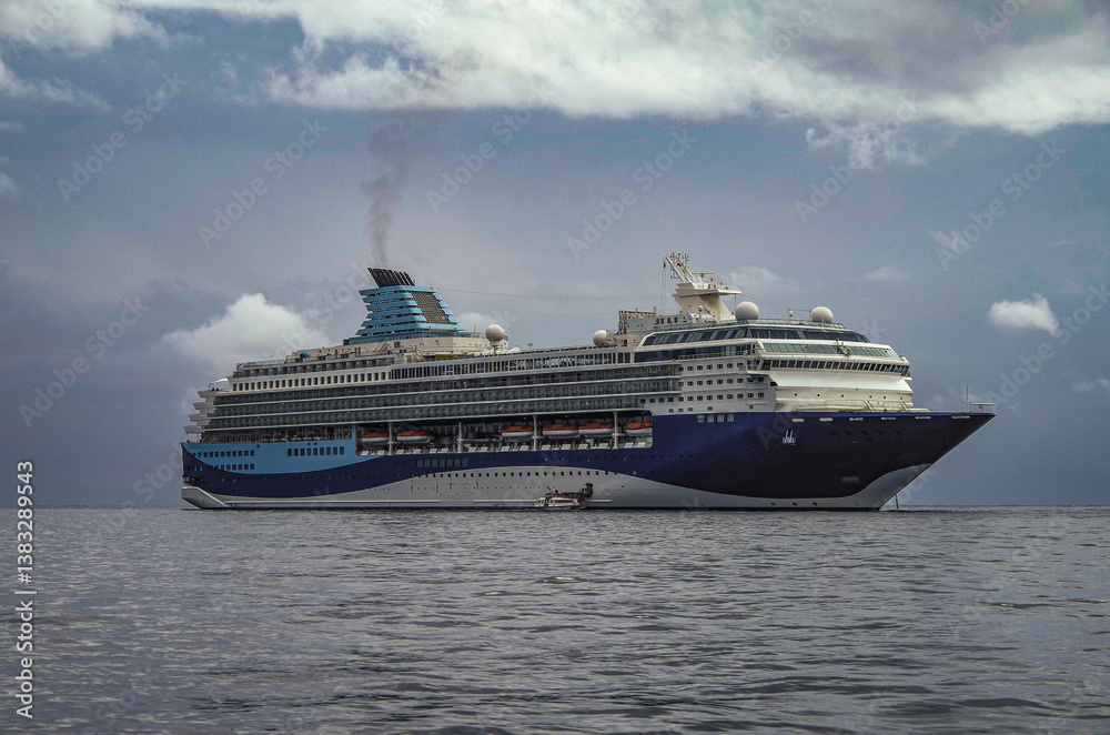Modern ruiseship cruise ship liner Explorer 2 anchored offshore of Zakynthos island in Greece during Aegean summer Greek Island cruising on cloudy day