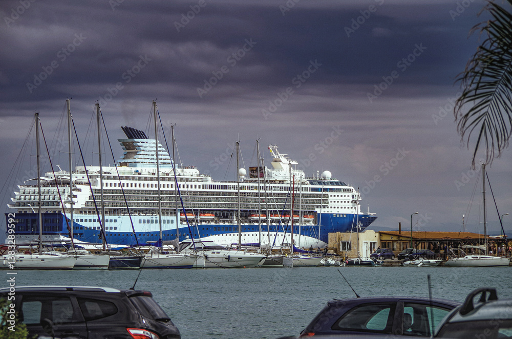 Modern ruiseship cruise ship liner Explorer 2 anchored offshore of Zakynthos island in Greece during Aegean summer Greek Island cruising on cloudy day