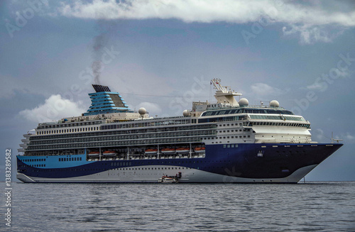 Obraz na płótnie Modern ruiseship cruise ship liner Explorer 2 anchored offshore of Zakynthos island in Greece during Aegean summer Greek Island cruising on cloudy day w salonie