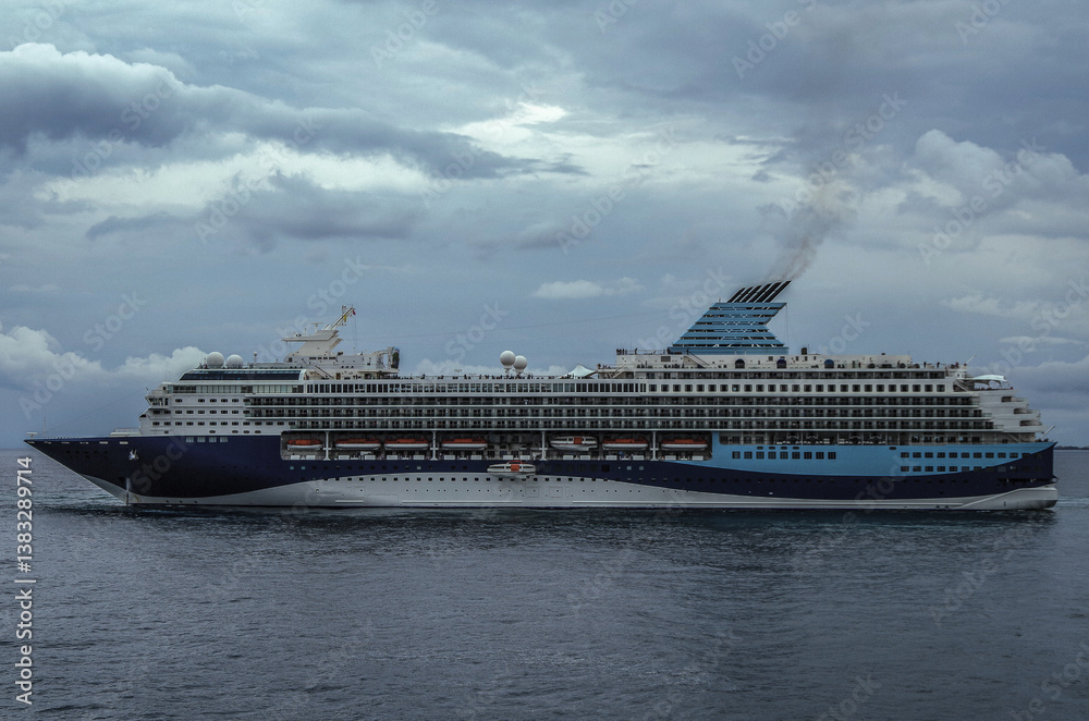 Modern ruiseship cruise ship liner Explorer 2 anchored offshore of Zakynthos island in Greece during Aegean summer Greek Island cruising on cloudy day