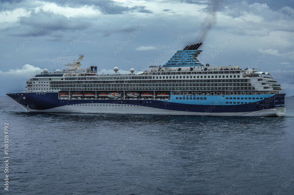 Modern ruiseship cruise ship liner Explorer 2 anchored offshore of Zakynthos island in Greece during Aegean summer Greek Island cruising on cloudy day