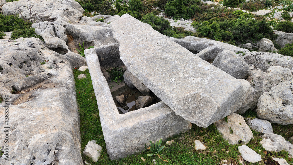 A Roman-era stone sarcophagus located within the ancient ruins of Sakizlik, in the Saglikli neighborhood of Tarsus, Mersin. A Roman-era stone sarcophagus located within the ancient ruins of Sakizlik, in the Saglikli neighborhood of Tarsus, Mersin.