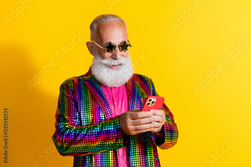 Tableau sur toile Photo of extravagant funny aged man use smart phone empty space wear shiny costu