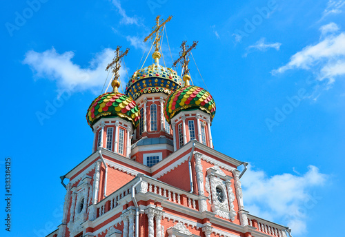 Russia, Nizhny Novgorod, Nativity or Stroganov Church. Multicolored domes of the church against the blue sky. photo