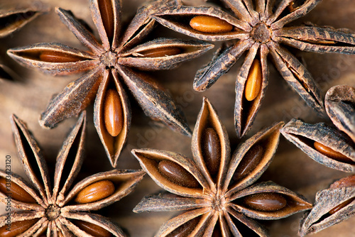 Fototapeta Naklejka Na Ścianę i Meble -  Macro shot of Star Anise herb on a wooden background.