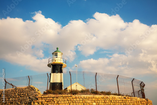 Obraz na płótnie Lighthouse in the old city of Acre against cloudy sky. (Akko), Israel w salonie