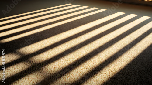 Morning light casting shadows of office blinds on neutral carpet in bright workspace environment