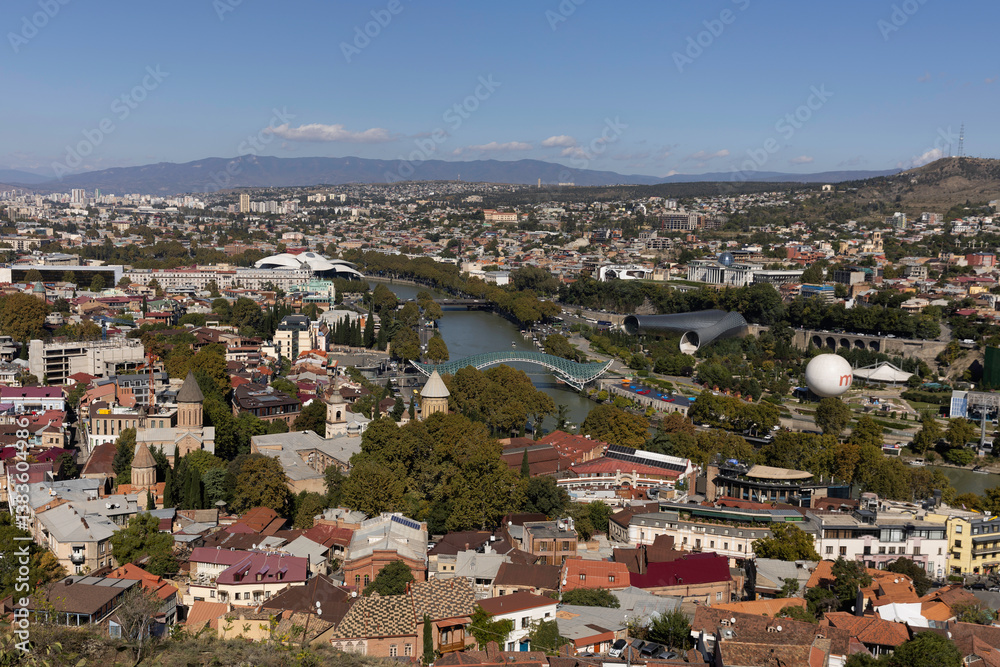 View of Tbilisi showcasing the vibrant cityscape and scenic landscapes during a clear sunny day View of Tbilisi showcasing the vibrant cityscape and scenic landscapes during a clear sunny day