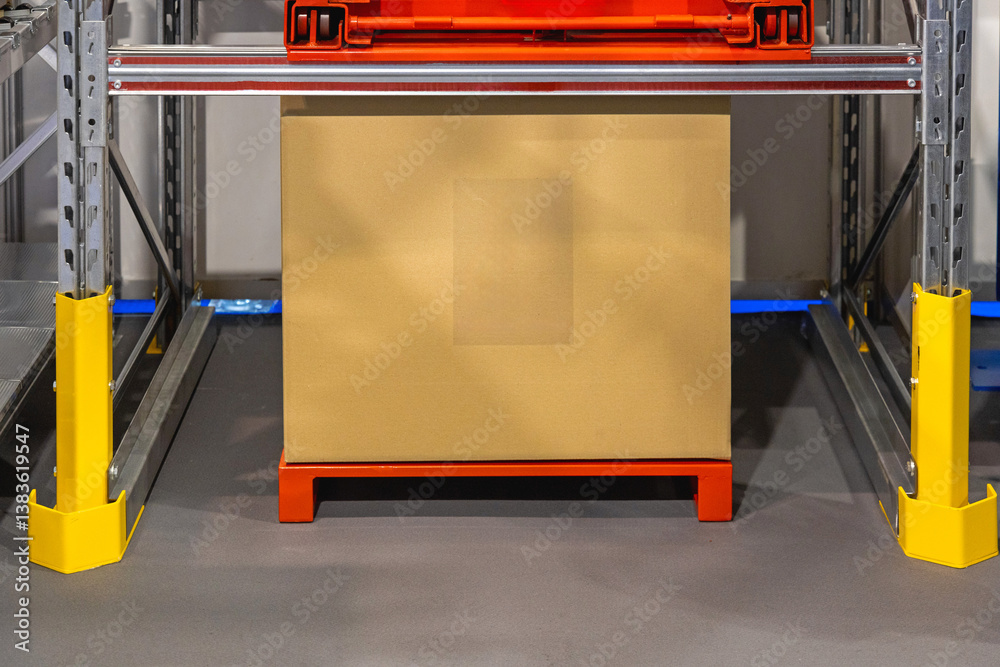 Cardboard Box at Red Pallet in Distribution Warehouse Storage Shelf
