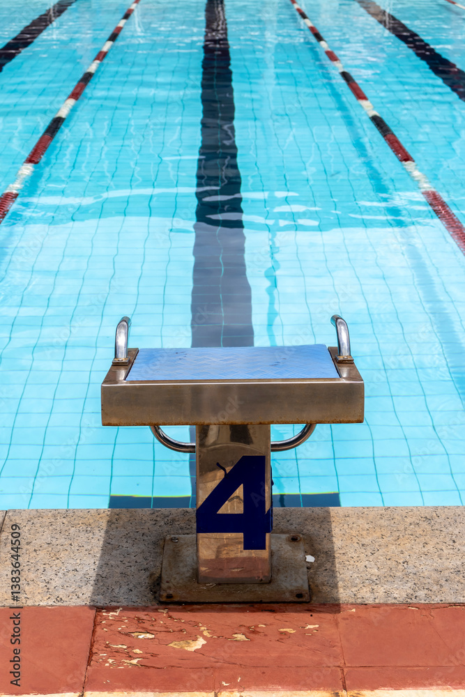 Starting platforms with number 4 for swimming races and competitions in Brazil. Swimming pool starting block No.4. Sport and swimming concept