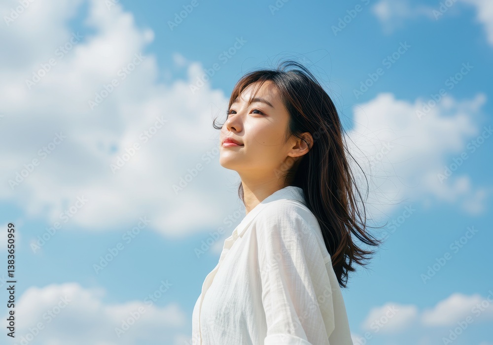 custom made wallpaper toronto digitalA bright uplifting outdoor portrait of a young Asian woman under a vivid blue sky with scattered clouds