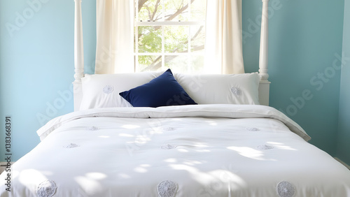 White canopy bed in blue bedroom features textured linens with dynamic outdoor shadows creating soft movement.