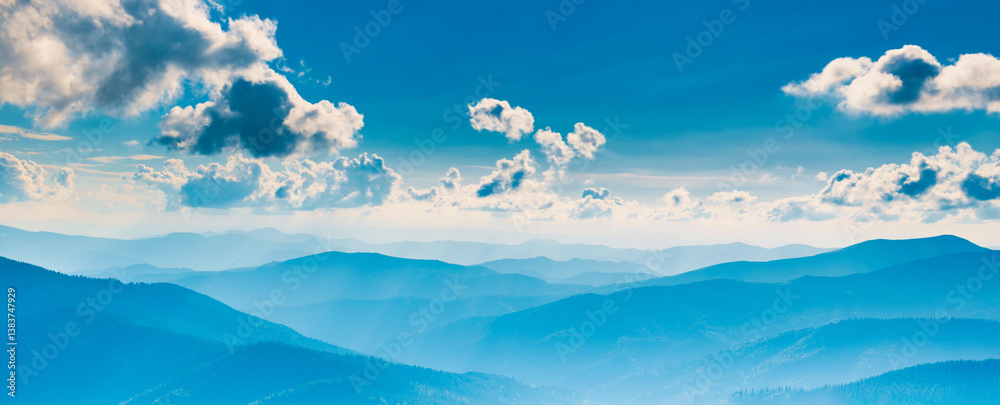 Blue mountains landscape with blue sky and clouds