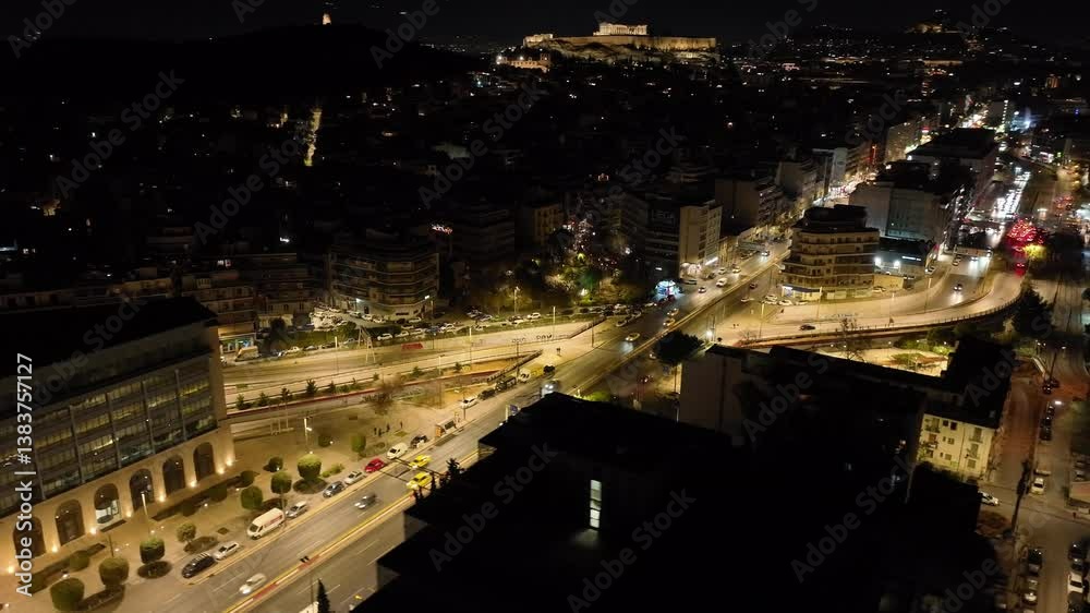 Aerial drone night cinematic video of illuminated Syggrou Avenue and landmark modern buildings crossing ancient Athens centre up to riviera seascape, Attica, Greece Aerial drone night cinematic video of illuminated Syggrou Avenue and landmark modern buildings crossing ancient Athens centre up to riviera seascape, Attica, Greece