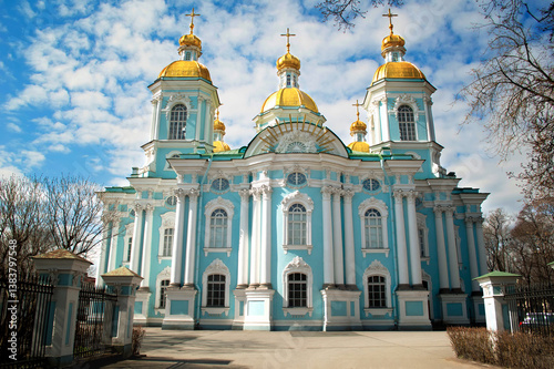 The St. Nicholas Naval Cathedral in St. Petersburg on Nikolskaya Square, Russia. The white and blue Baroque cathedral with golden domes. View of the cathedral on a sunny spring morning