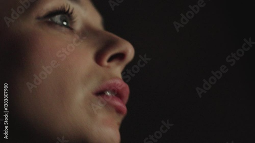 Close up portrait a woman speak on cell phone about work. Girl have call with client on background big city light. Business woman do business. Young woman talking on phone in apartment at night. 