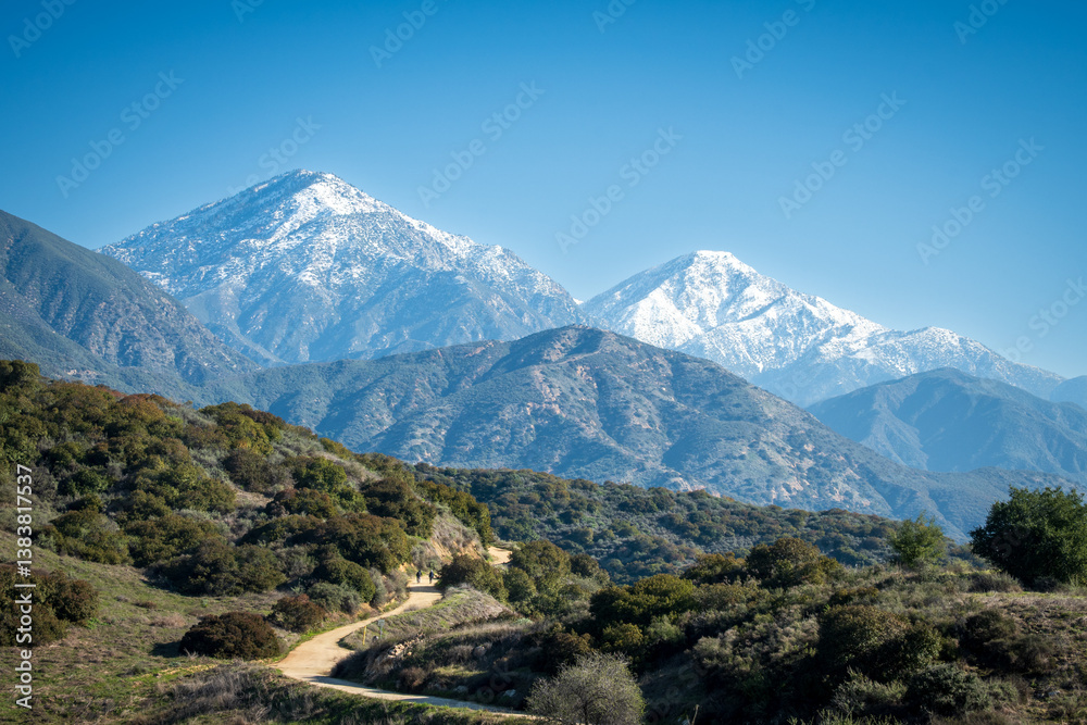 Fototapeta premium snow capped mountains and trail
