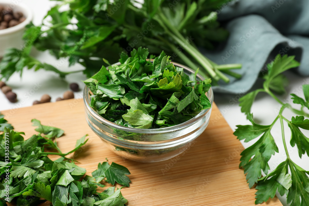 Fresh parsley in bowl on white table, closeup Fresh parsley in bowl on white table, closeup