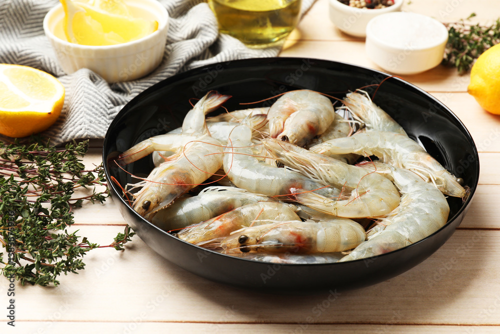 Fresh raw shrimps and spices on wooden table, closeup Fresh raw shrimps and spices on wooden table, closeup