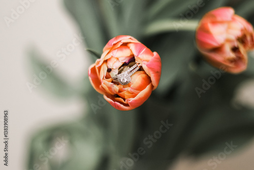 a beautiful engagement ring in a pink tulip