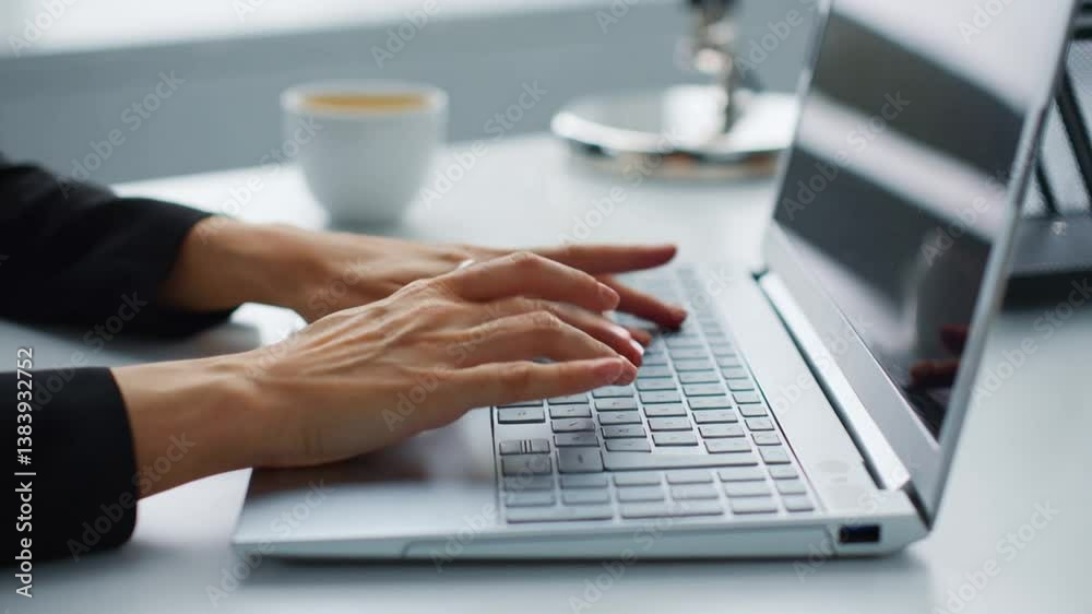 Close-up of hands typing quickly and accurately on the keyboard of a modern laptop. Close-up of hands typing quickly and accurately on the keyboard of a modern laptop.