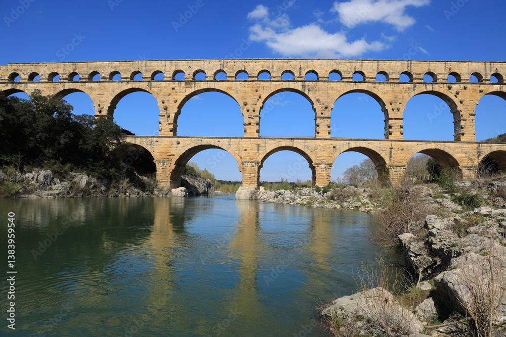 Fototapeta premium Pont du Gard, an ancient Roman aqueduct Bridge located on the Gardon River in Gard Department, southern France