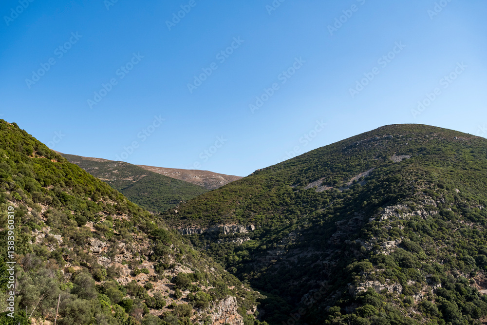 Naklejka premium Mountainous landscape covered with sparse flora in Mediterranean region