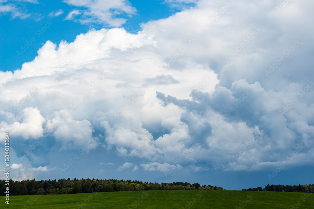 Heavy rain clouds pass over the countryside before the downpour Heavy rain clouds pass over the countryside before the downpour