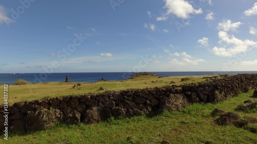 Explore the breathtaking beauty of Easter Island near Orongo volcano with avocado trees under blue skies
