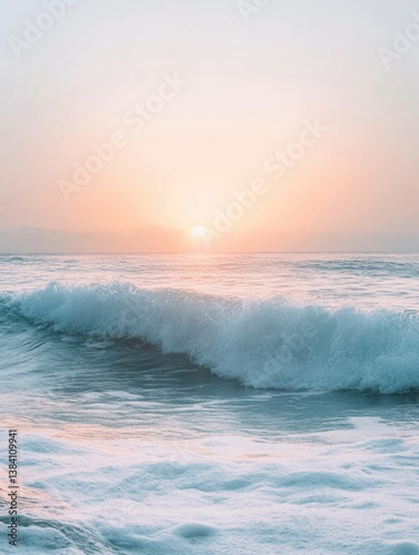 Serene seascape with gentle waves and pastel sunrise sky at dawn