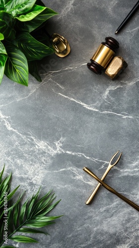 Elevated gray marble surface with decorative objects and greenery