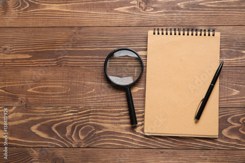 Blank notebook, magnifier a...