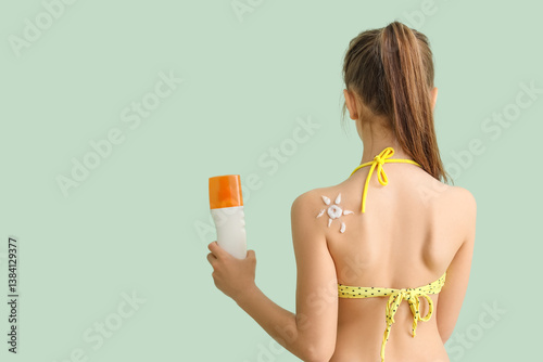 Little girl with bottle of ...