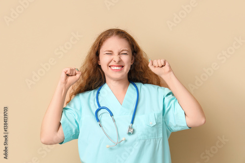 Happy female doctor on beig...