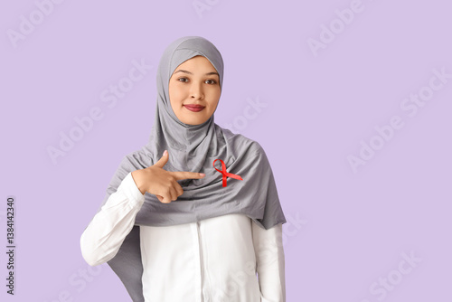 Beautiful Muslim woman poin...