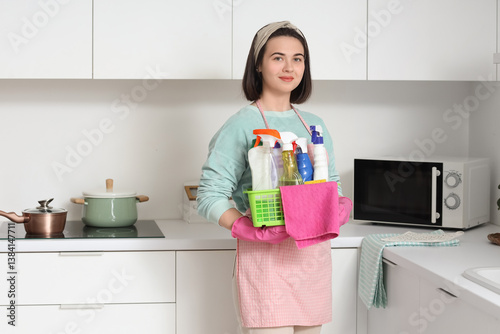 Young woman holding basket ...