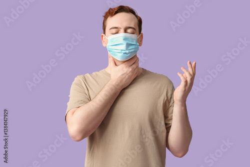 Young man with sore throat ...