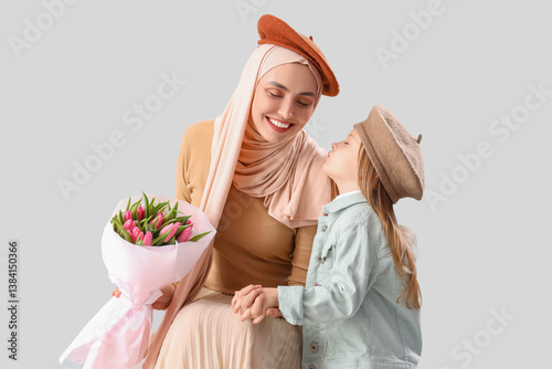 Young Muslim woman with tul...