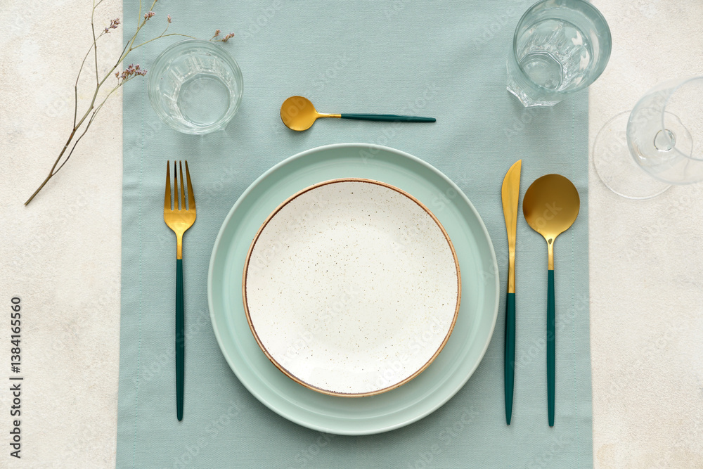 Stylish table setting with blue cloth on white background. Top view