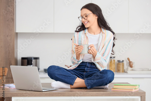 Teenage girl with cup of co...