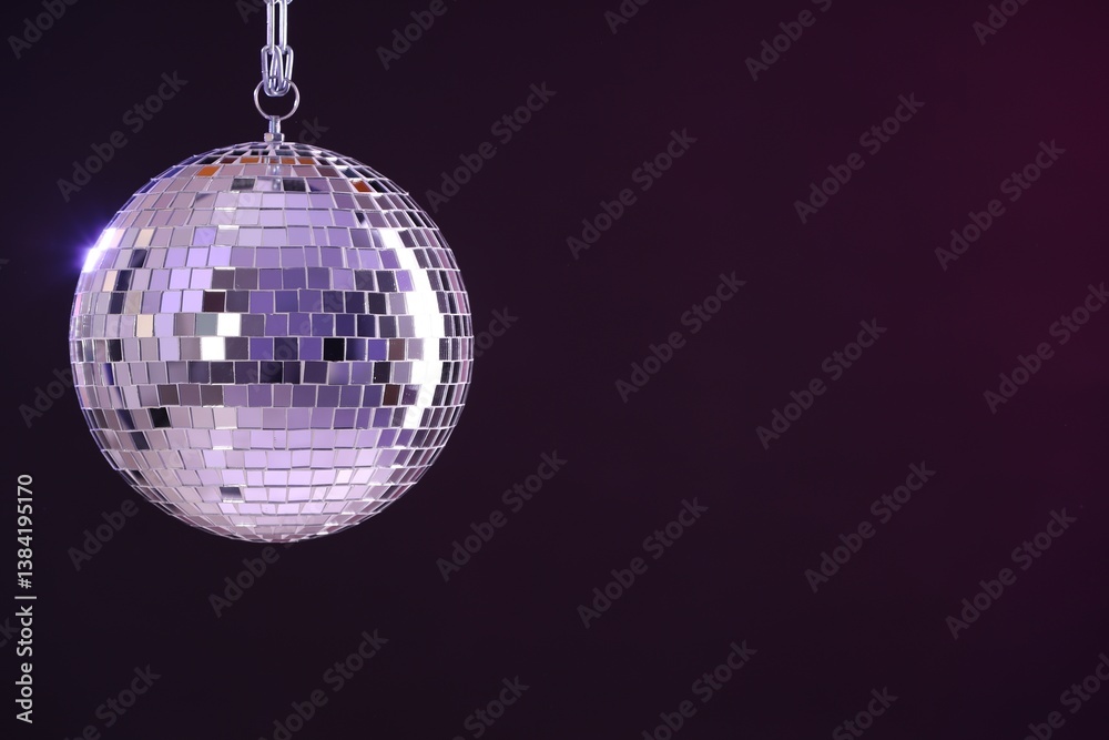 Fototapeta premium Shiny disco ball on dark purple background, space for text