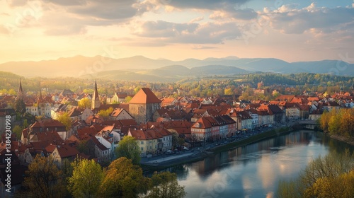 Sunset over river town, mountain backdrop, spring foliage, travel postcard