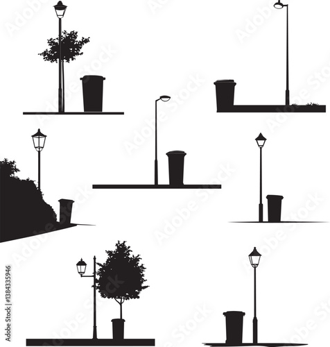Silhouette of a bin next to a streetlamp on a quiet road