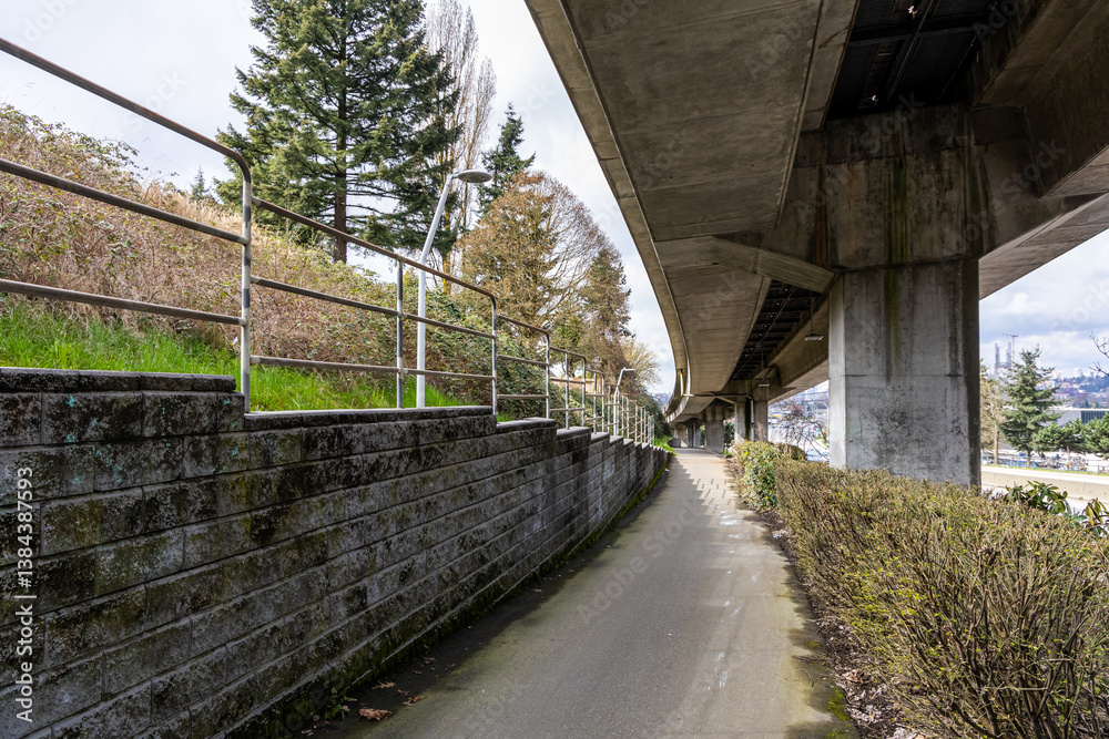 Paved Pathway with Urban Infrastructure and Scenic Surroundings in Vancouver, BC, Canada Paved Pathway with Urban Infrastructure and Scenic Surroundings in Vancouver, BC, Canada