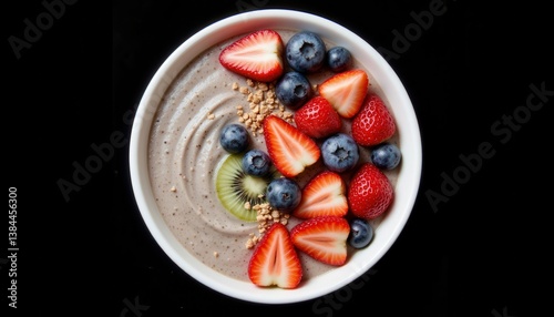Obraz na płótnie A bowl of creamy chia pudding, with a smooth texture, is adorned with an assortment of vibrant fruits such as strawberries w salonie