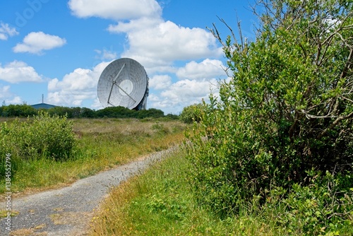 Fototapeta Naklejka Na Ścianę i Meble -  Helston England - 11 June 2024 - Satellite dishes on the Goonhilly Satellite Earth Station on the Goonhillly Downs on the Lizard Peninsula in Cornwall England
